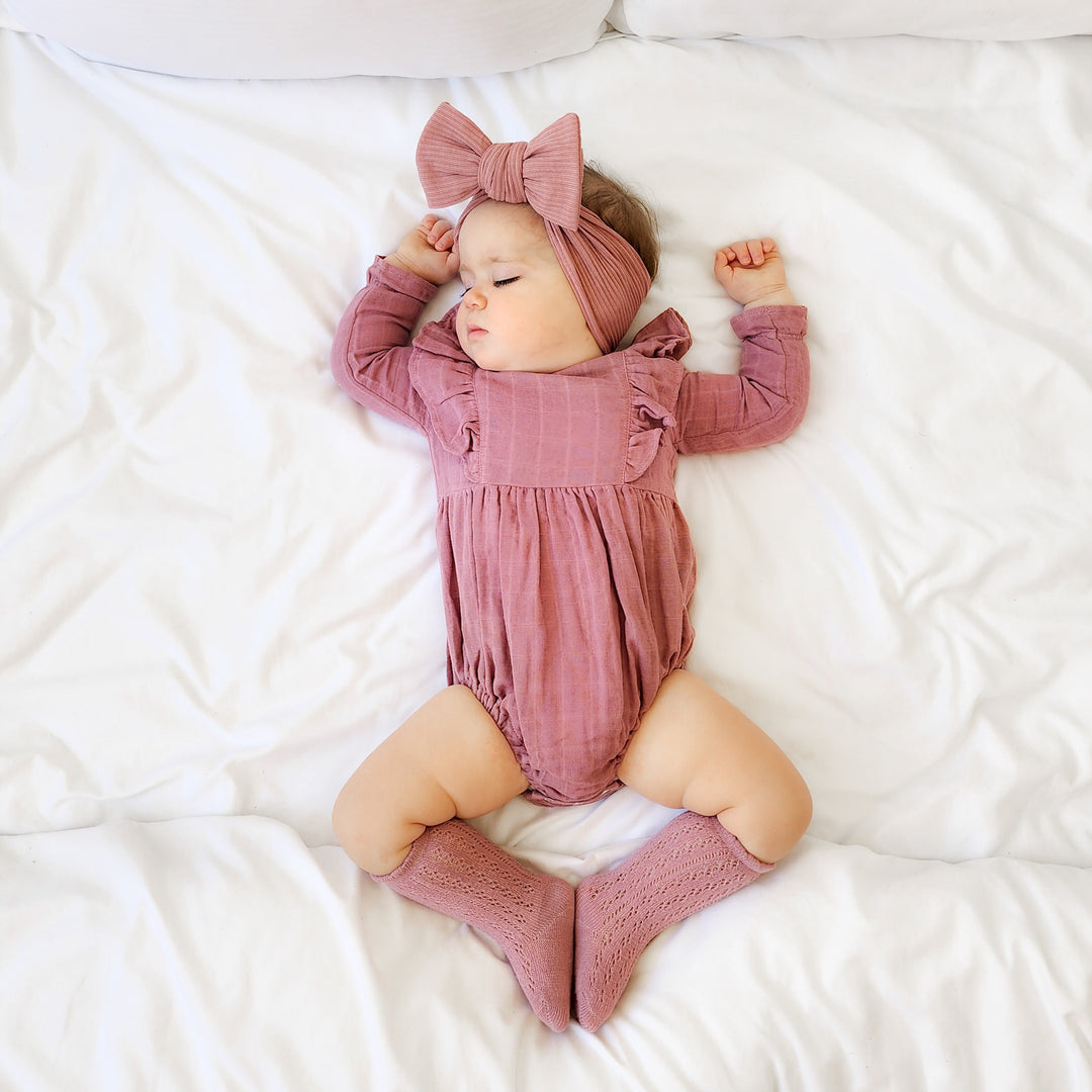 baby girl mauve long sleeve muslin romper with frill