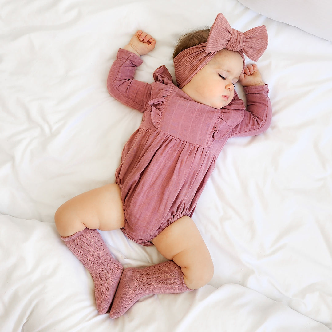 baby girl mauve long sleeve muslin romper with frill