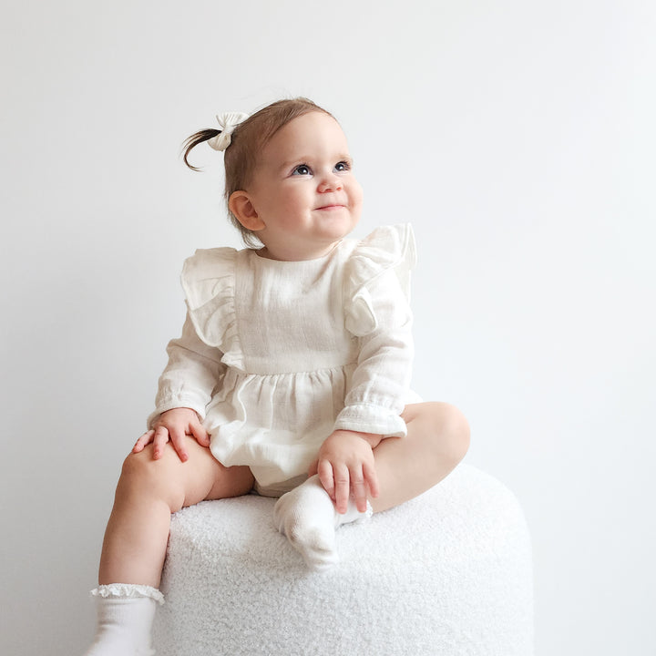 baby girl white long sleeve muslin romper with frill