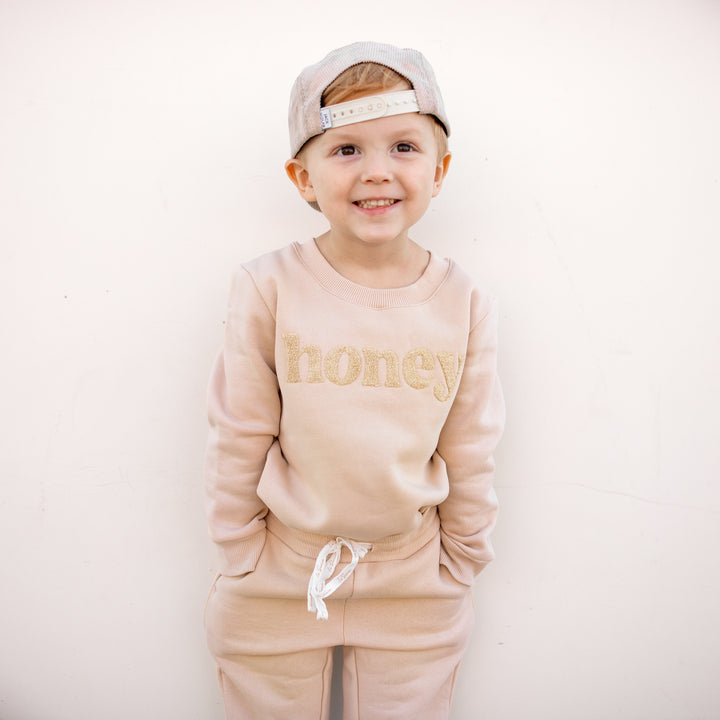 kids unisex oatmeal jumper with honey text