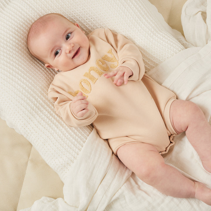 unisex baby oatmeal romper with honey text