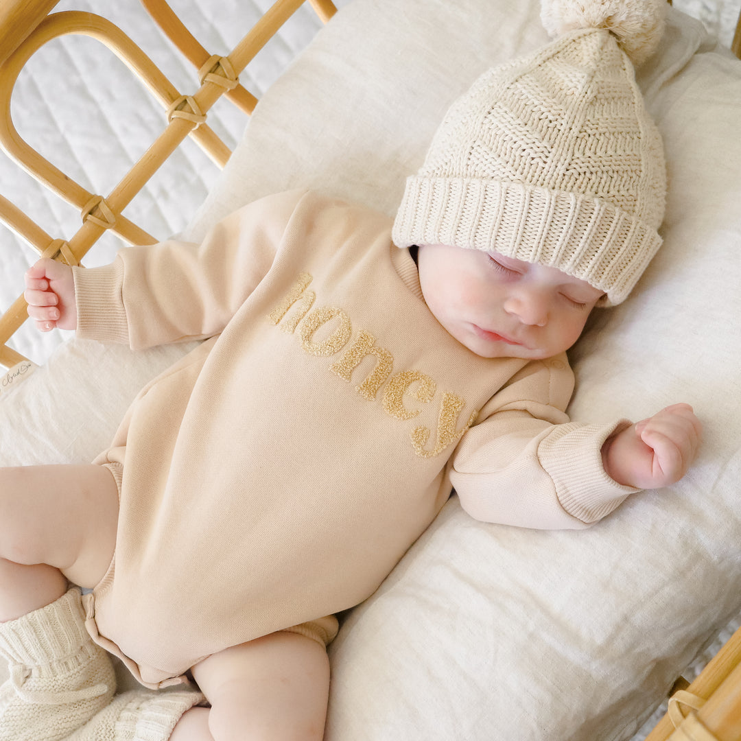 unisex baby oatmeal romper with honey text