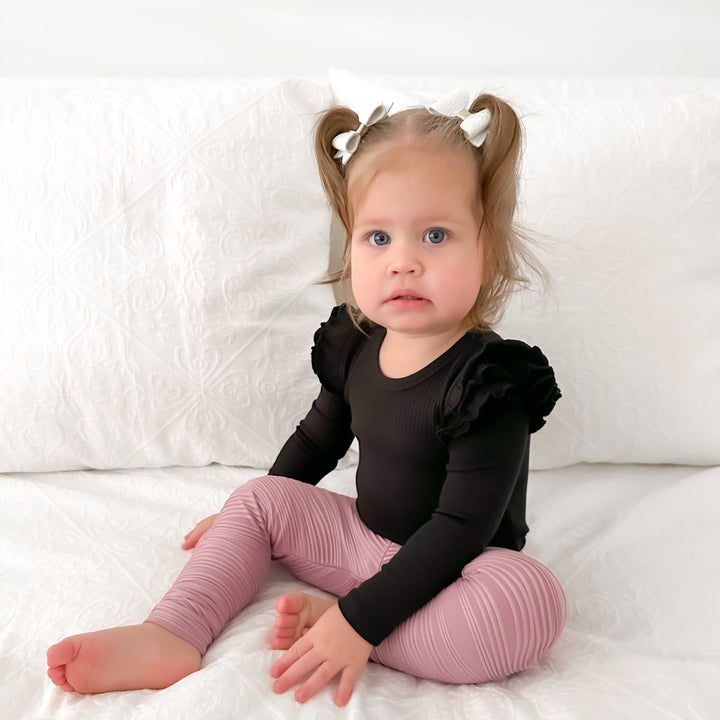 Baby girls black ribbed long sleeve bodysuit with flutter