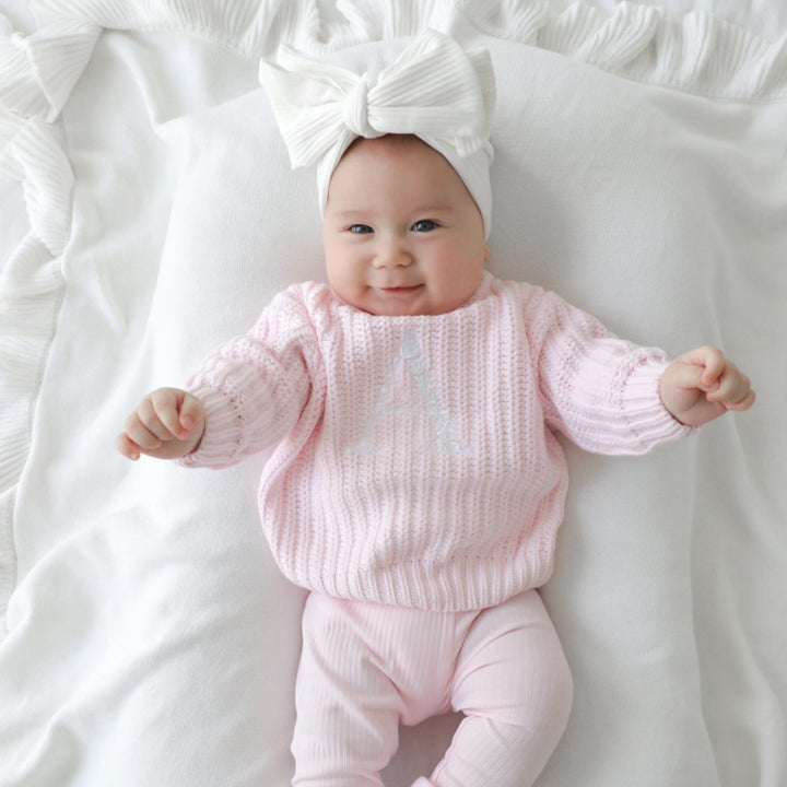 Pink baby knitted jumper with personalised embroidery