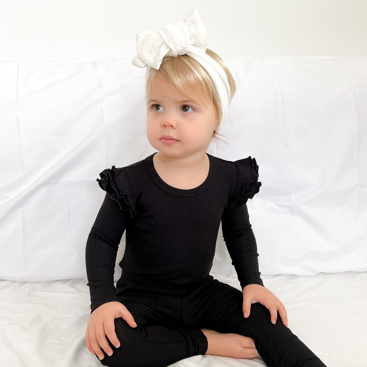 Baby girls black ribbed long sleeve bodysuit with flutter